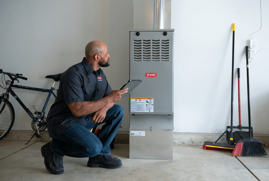 FURNACE INSTALL (1) Men looking at a new furnace installation